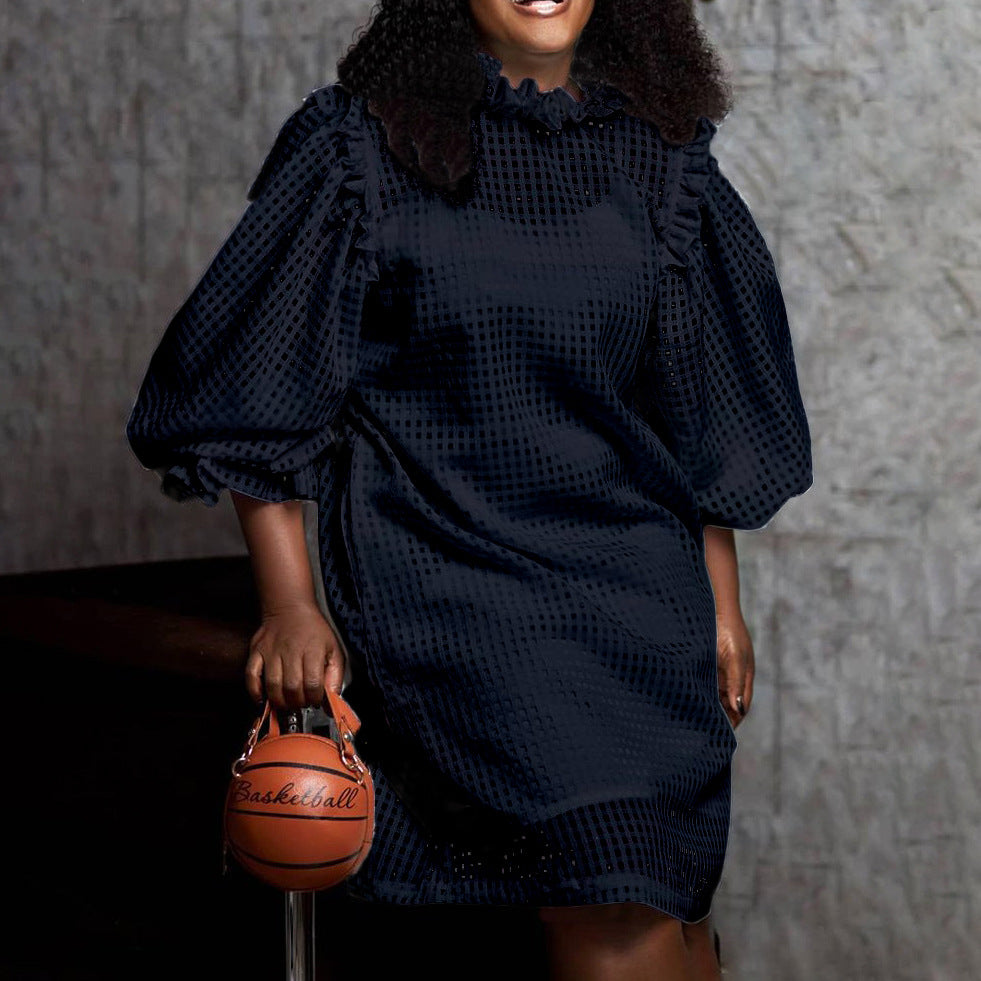 Transparent dress for women with voluminous puff sleeves and a chic check pattern.