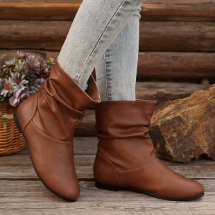 Fashionable women's ankle boots with an elegant ruffle design and a soft upper material Lune London