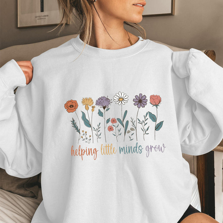 Sweat-shirt femme avec des manches volumineuses et un imprimé floral motivant Chic & Stil