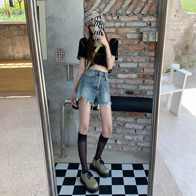 Women's denim shorts with frayed hems and unique embroidery detail Lune London