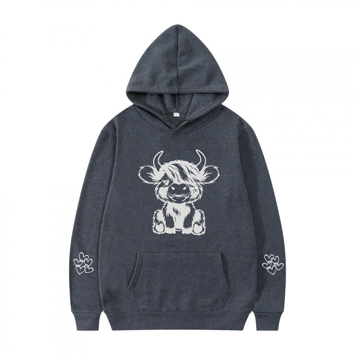 Women's hooded sweatshirt with charming cow motif and practical kangaroo pockets Lune London