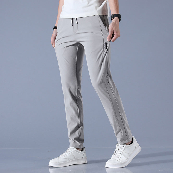 Sports jogger pants for men with elastic waist and practical zip pockets Lune London