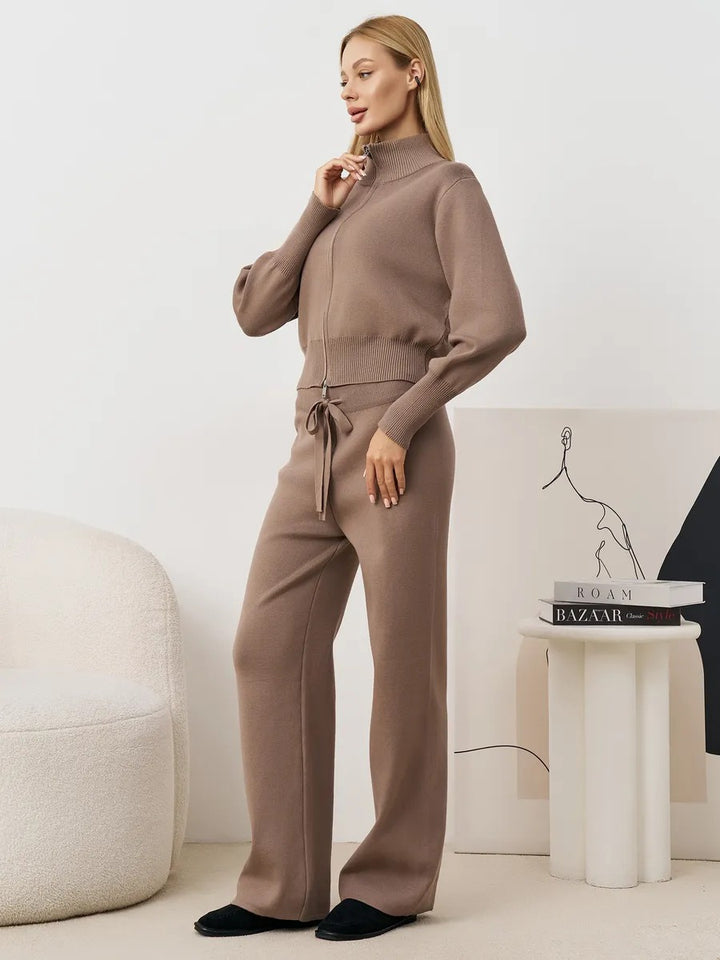 Ladies comfortable knit jumpsuit with high collar and side lace details Lune London