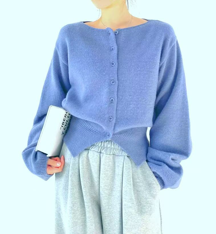 Pull cropped femme avec des détails de boutons et des manches surdimensionnées Chic & Stil