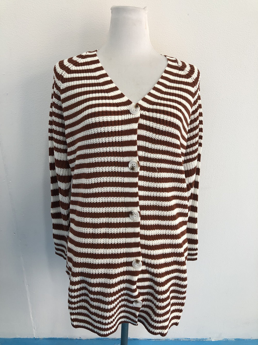 Ladies long sleeve knit cardigan with a modern striped pattern and buttons Lune London