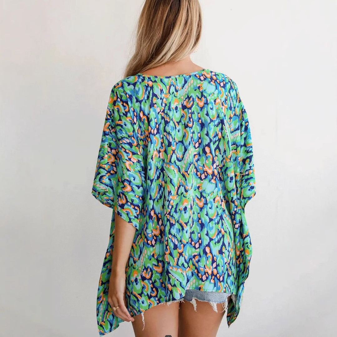 Casual beach blouse for women with an asymmetrical cut and colorful pattern Lune London