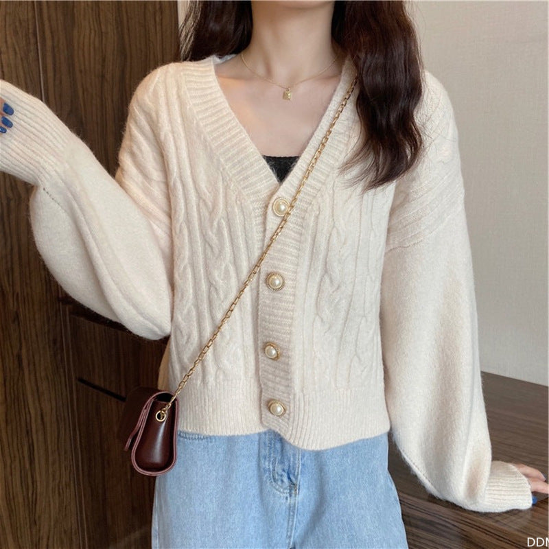 Knitted jacket for women with an elegant braid pattern and high-quality button details Lune London