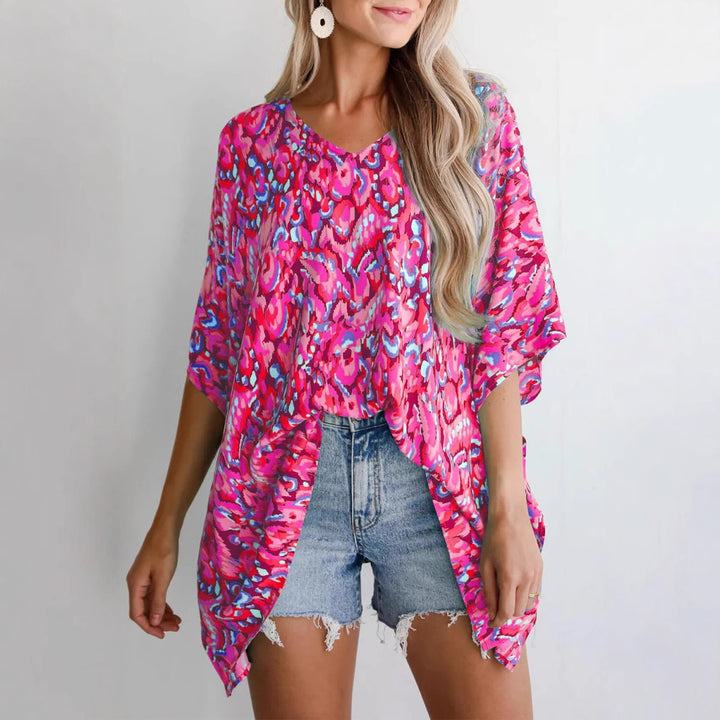 Casual beach blouse for women with an asymmetrical cut and colorful pattern Lune London