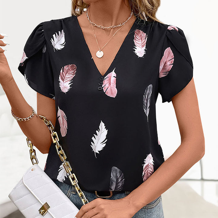 Haut féminin avec motif floral en feuilles et détails de boutons décoratifs Chic & Stil