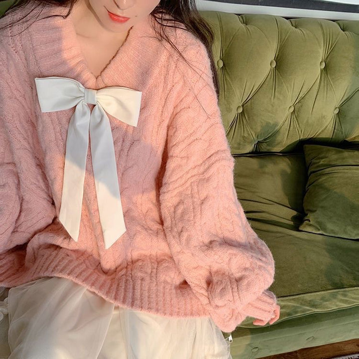 Ladies Large knitted sweater with bow detail and cable knit pattern Lune London