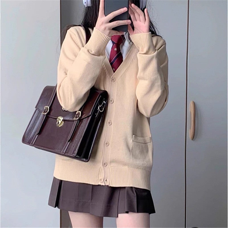 Cardigan féminin ludique avec grand col et détail de nœud Chic & Stil