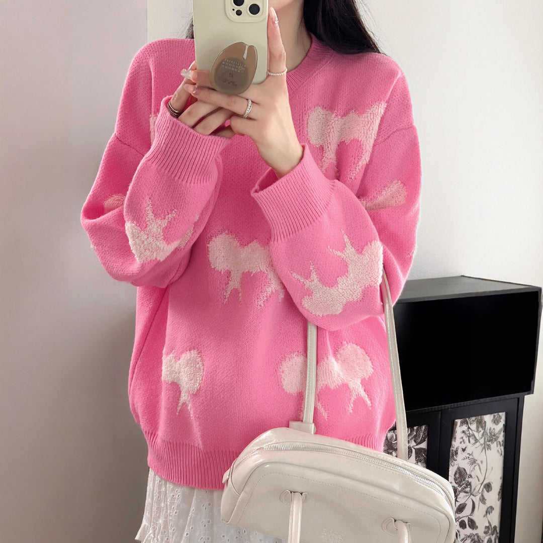 Cozy knitted sweater for women with playful bow pattern Lune London