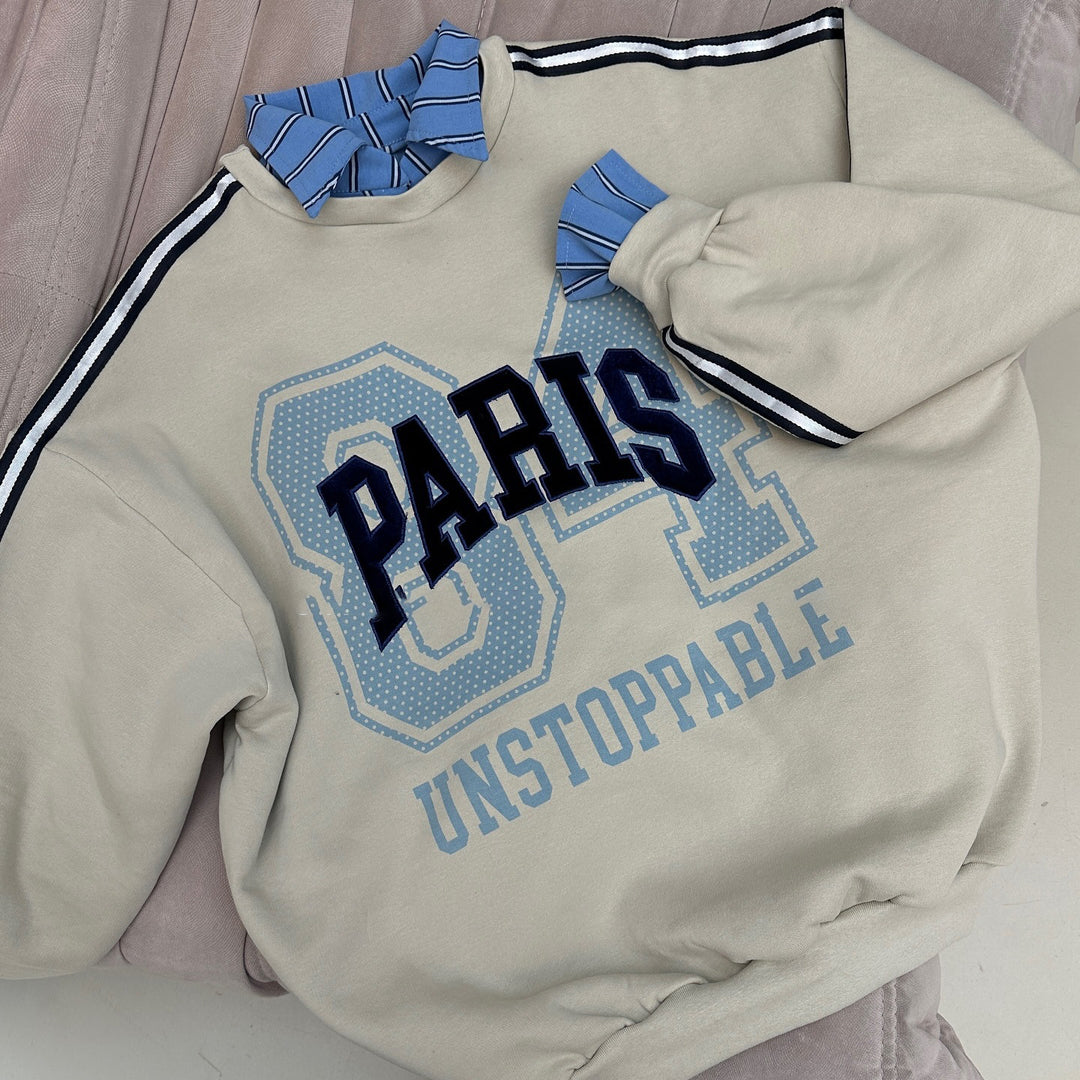 Oversized sweatshirt for women with Paris fashion print and striped accents Lune London