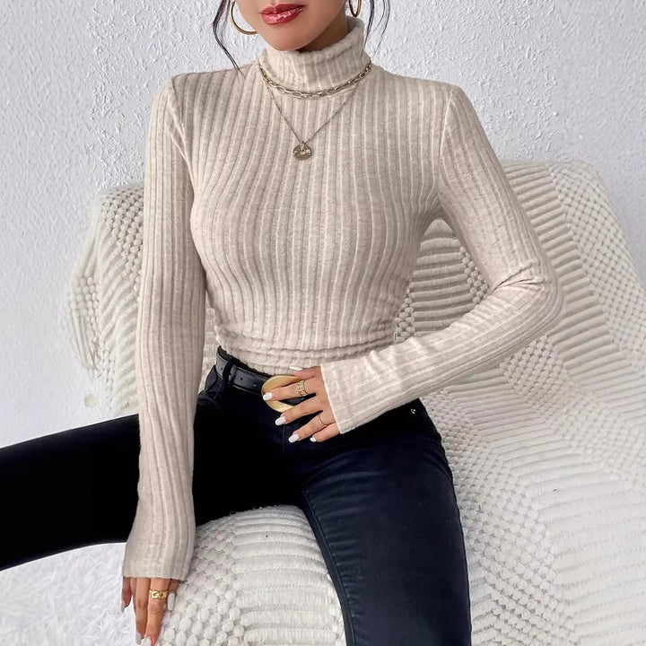 Ladies elegant ribbed knit top with high collar and longer cut Lune London