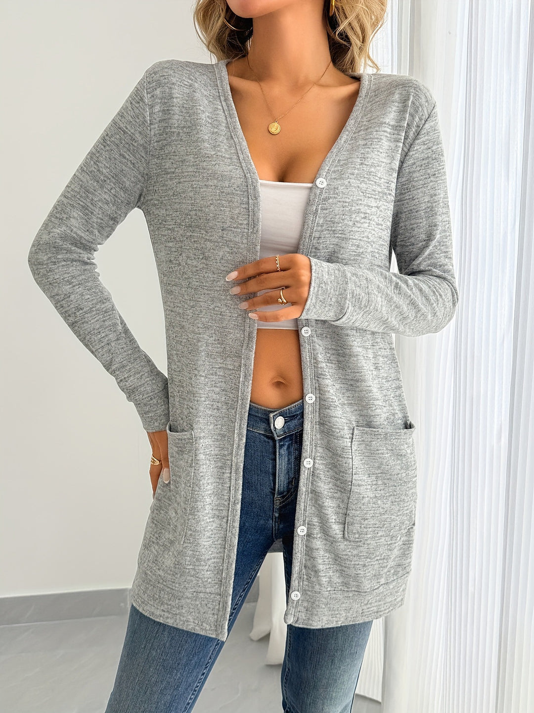 Ladies long sleeve cardigan with practical pockets and button placket Lune London