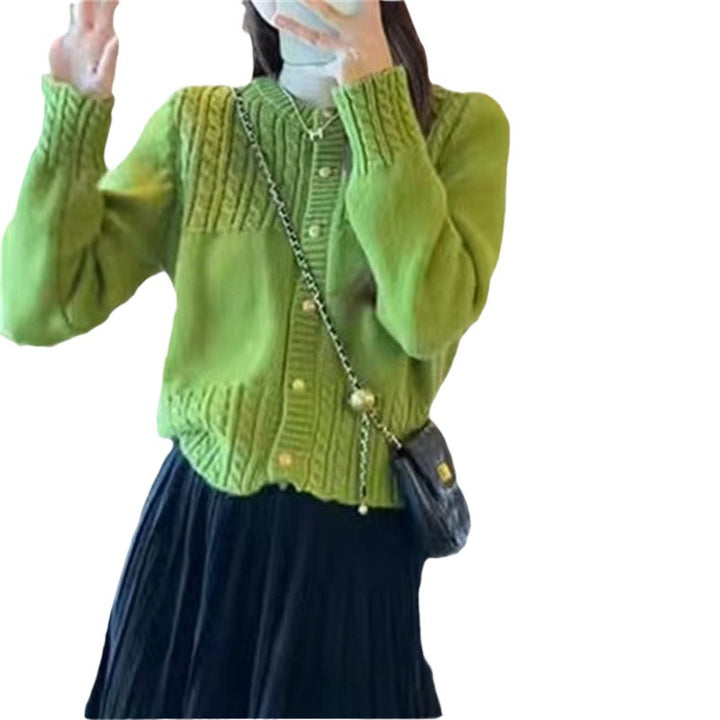 Ladies cozy knit pullover with cable texture and chic gold button details