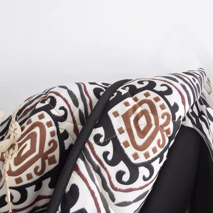 Veste matelassée élégante pour femmes avec ceinture à la taille et manches larges Chic & Stil