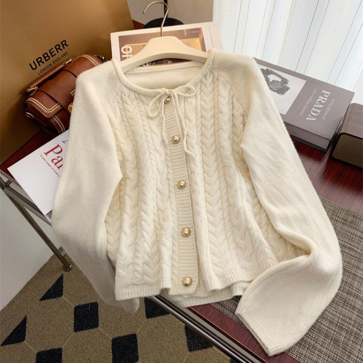 Women’s knitted jacket with embossed pattern and decorative button details Lune London
