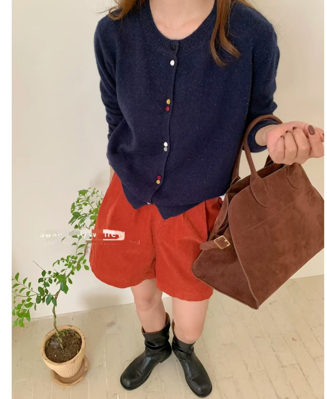 Knitted jacket for women with decorative button accents and soft material Lune London