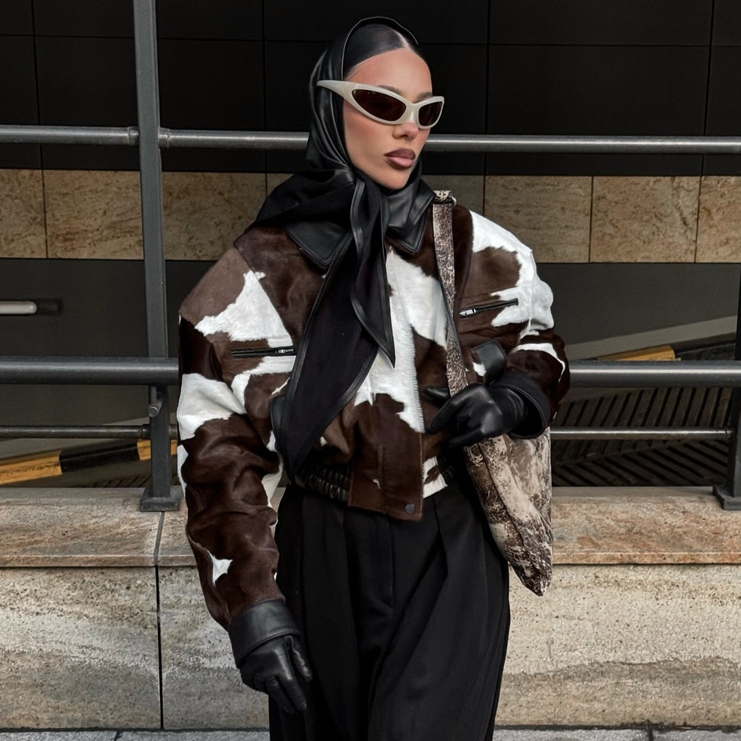 Ladies stylish faux leather jacket with a modern design in chic animal fur