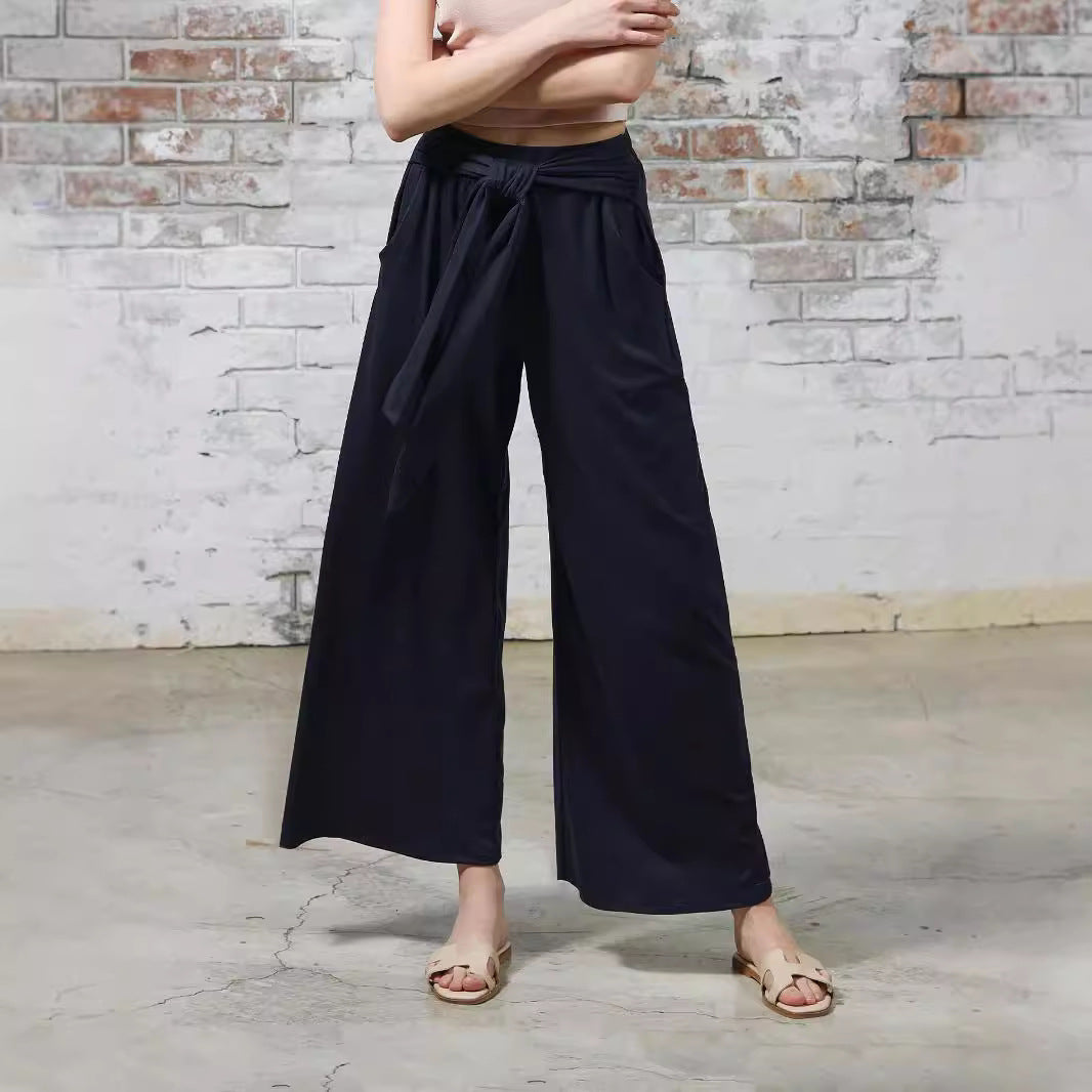 Loose jersey pants for women with a tie belt and high waist Lune London