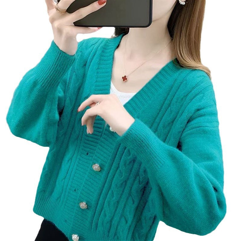 Knitted jacket for women with an elegant braid pattern and high-quality button details Lune London