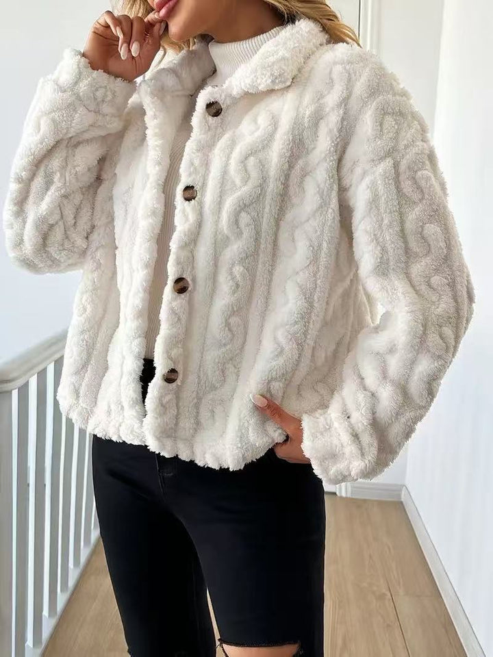 Women’s plush jacket with button closure and striped design.