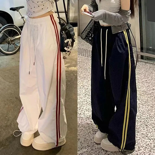 Women's casual sports pants with side stripes and elastic waistband