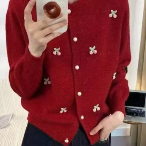 Women's knit jacket with a playful design and chic pearl buttons
