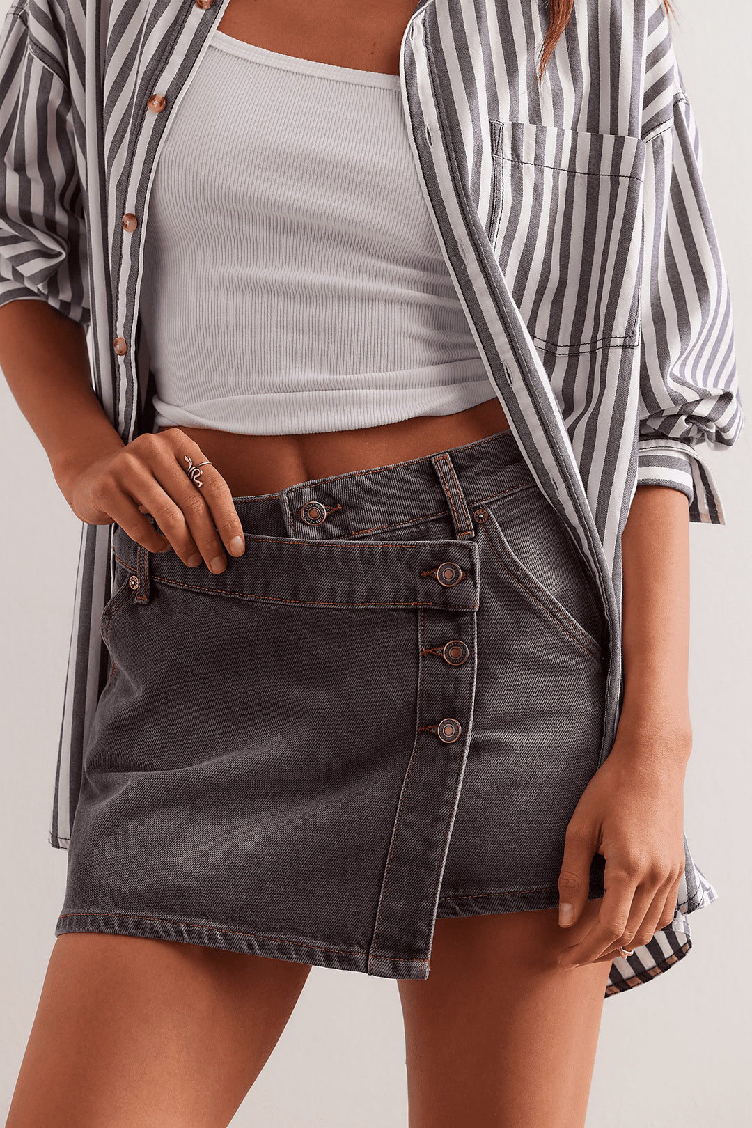 Women's fashionable A-line denim skirt with asymmetric button design and practical pockets Lune London