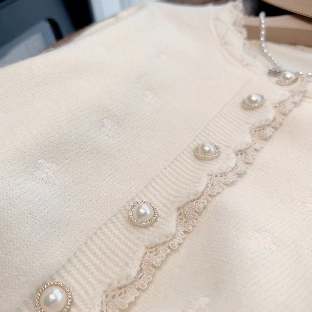 Knitted jacket for women with decorative pearl buttons and a delicate ribbed structure Lune London
