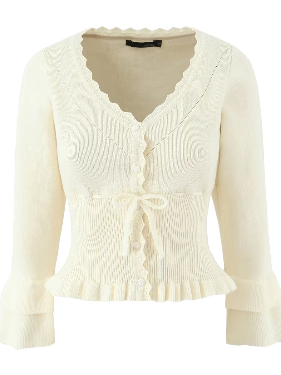 Short sleeve knitted jacket for women with ruffle details and button closure Lune London