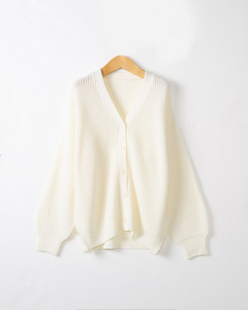 Women's knitted jacket with structured pattern and practical button details Lune London