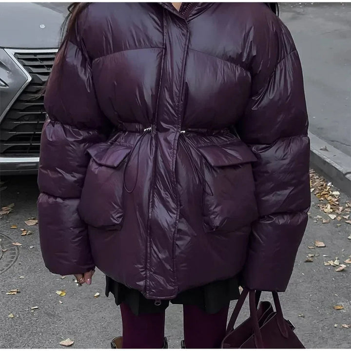 Oversized fashionable down jacket for women with a belted waist and side pockets Lune London
