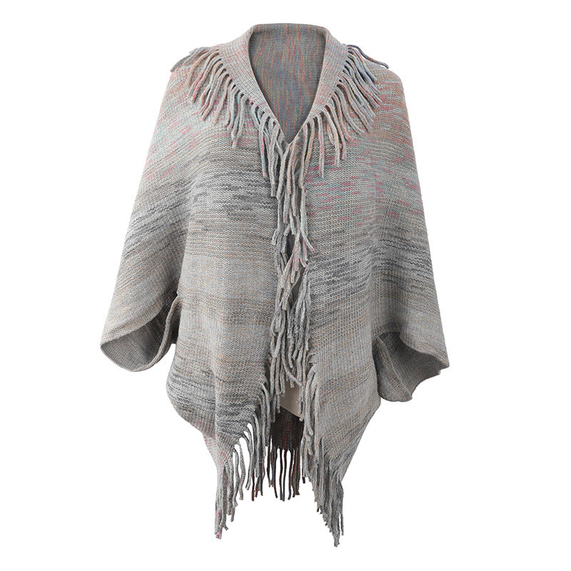 Trendy women's poncho with fringed hem and structured design Lune London