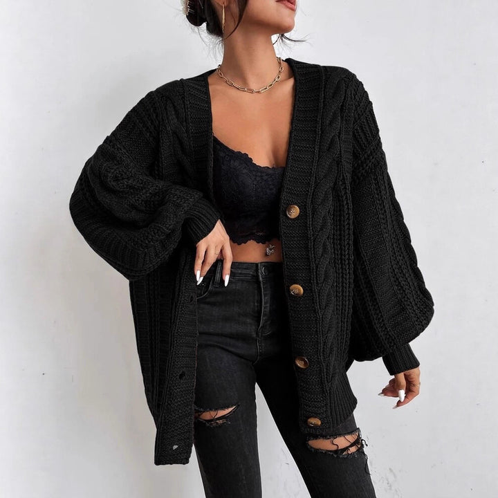 Oversized knitted cardigan for women with an elegant cable pattern and practical buttons Lune London