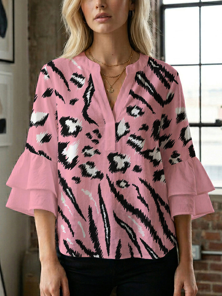 Women's blouse with ruffle details and eye-catching animal print Lune London