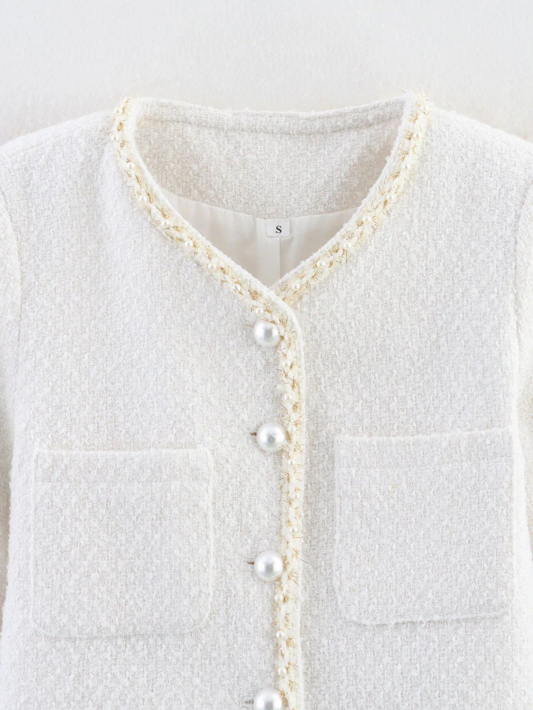 Elegant short-sleeve women's jacket with pearl-adorned buttons and patch pockets Lune London