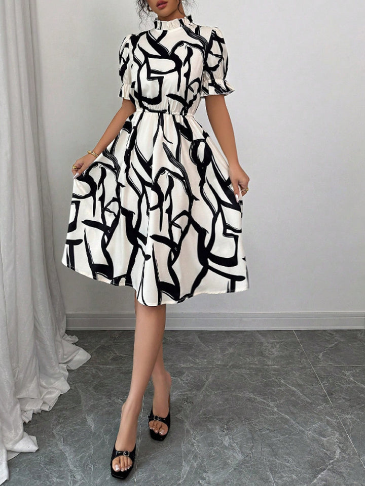 Robe midi élégante pour femmes avec motif de plantes stylé et taille élastique Chic & Stil