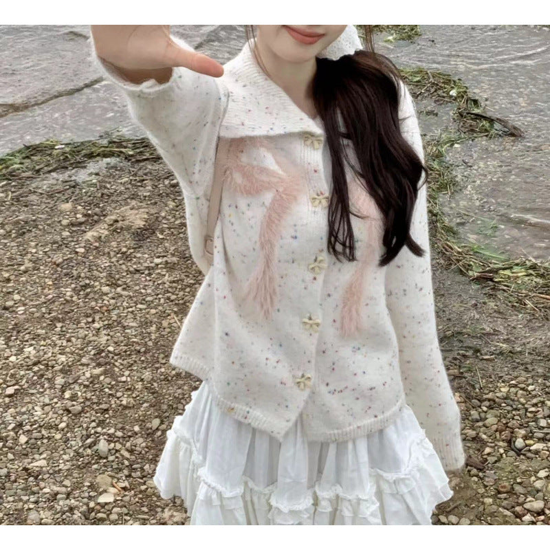 Women’s playful knitted vest with decorative button details and fluffy applications Lune London