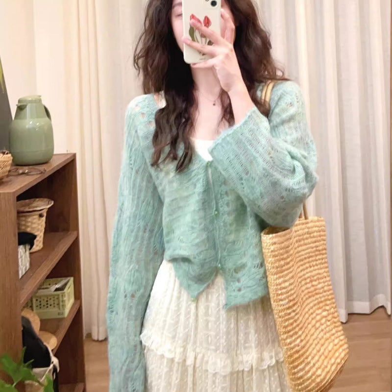 Lightweight knit cardigan for women with a fine openwork knit structure and a loose fit Lune London