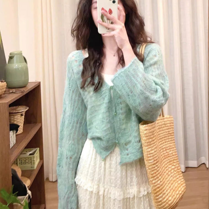 Lightweight knit cardigan for women with a fine openwork knit structure and a loose fit Lune London