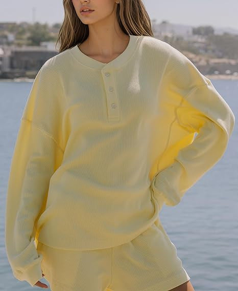 Dames loisirs t-shirt à manches longues pull avec détails de boutons Chic & Stil