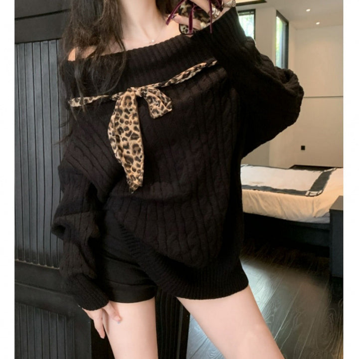 Chunky knit sweater for women with off-the-shoulder design and playful bow accent Lune London