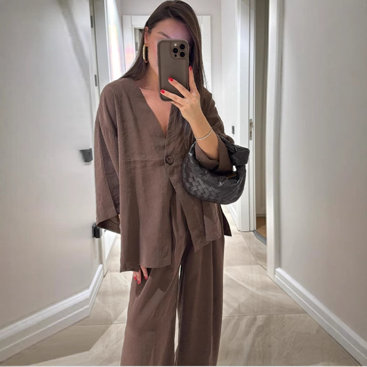 Ladies outfit consisting of an elegant V-neck blouse and wide palazzo pants Lune London