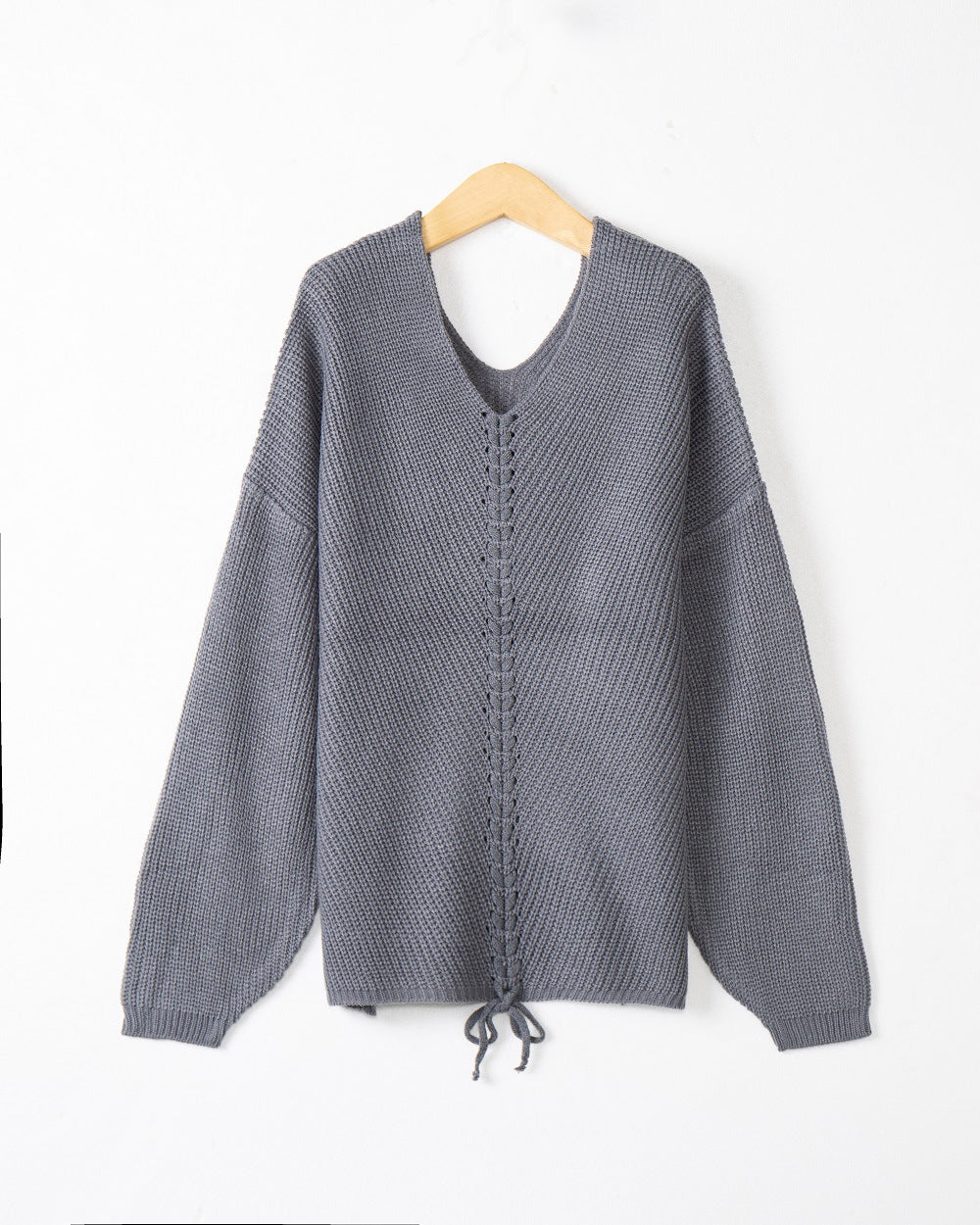 Women's thick knit sweater with an attractive V-neckline and practical drawstring details Lune London