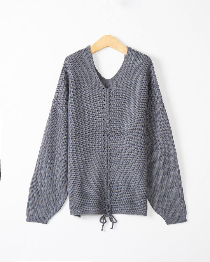 Women's thick knit sweater with an attractive V-neckline and practical drawstring details Lune London