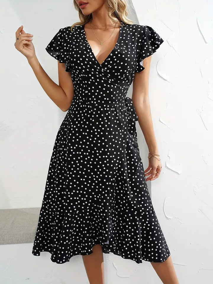 Women's wrap dress with dots and playful skirt detail Lune London