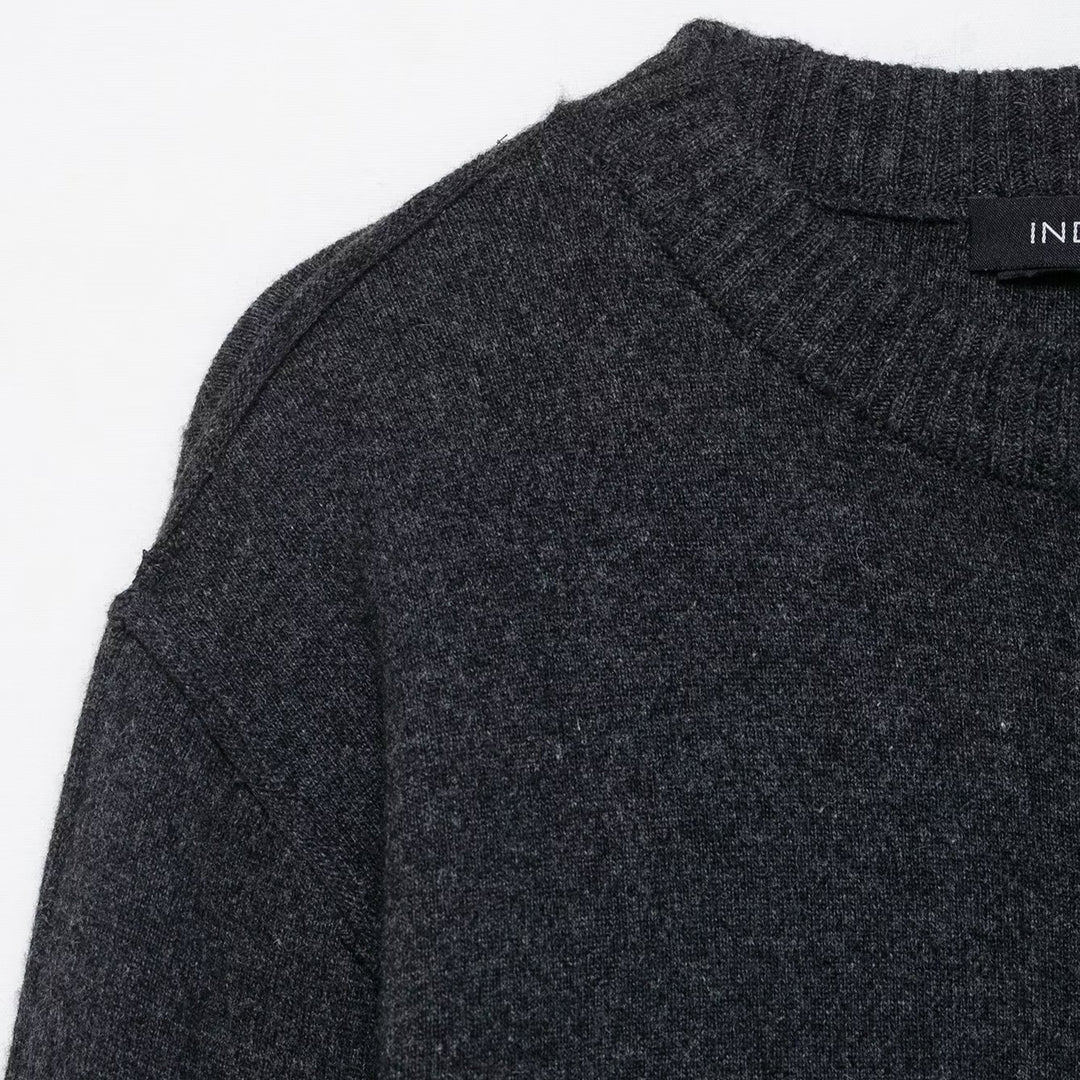 Trendy women's knitted jacket with contrasting sleeves and a continuous button placket Lune London