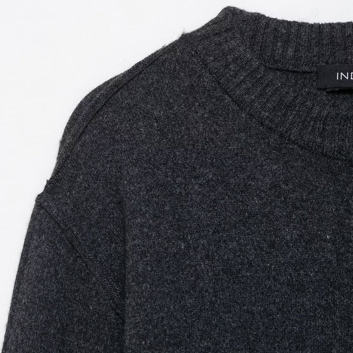 Trendy women's knitted jacket with contrasting sleeves and a continuous button placket Lune London
